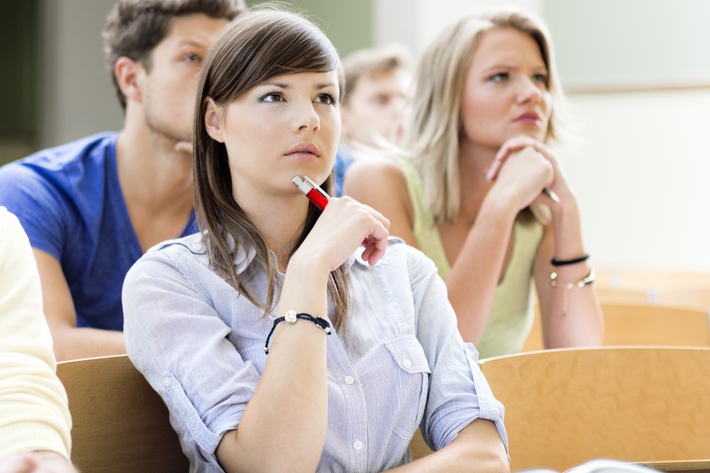 thoughtful college students in class