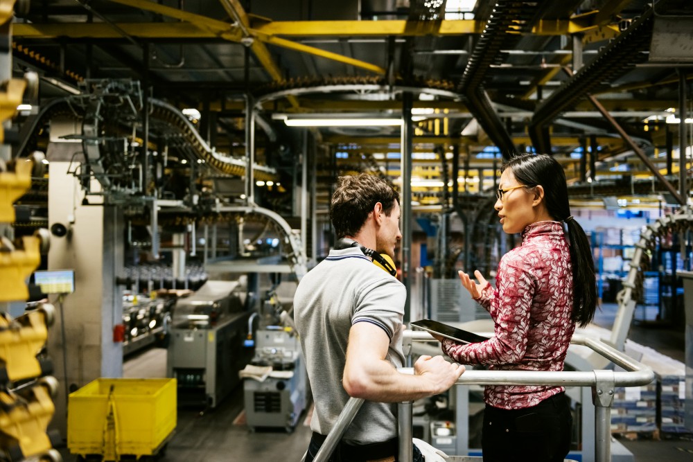 two people talking in industrial location